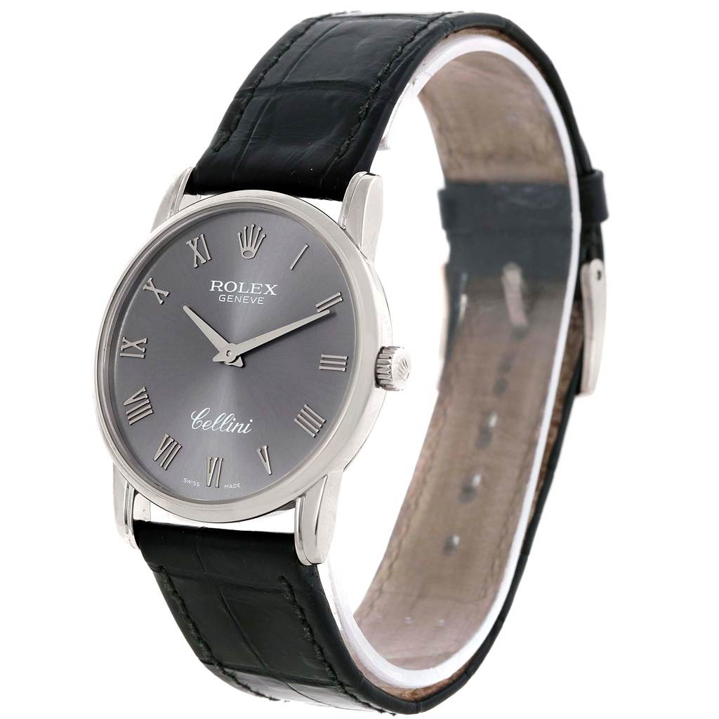 The Rolex Cellini 5116 Men's White Gold Grey Dial 5116 Men's White Gold Grey Dial watch is shown from a slightly angled side view, showcasing the face, bezel, and strap.