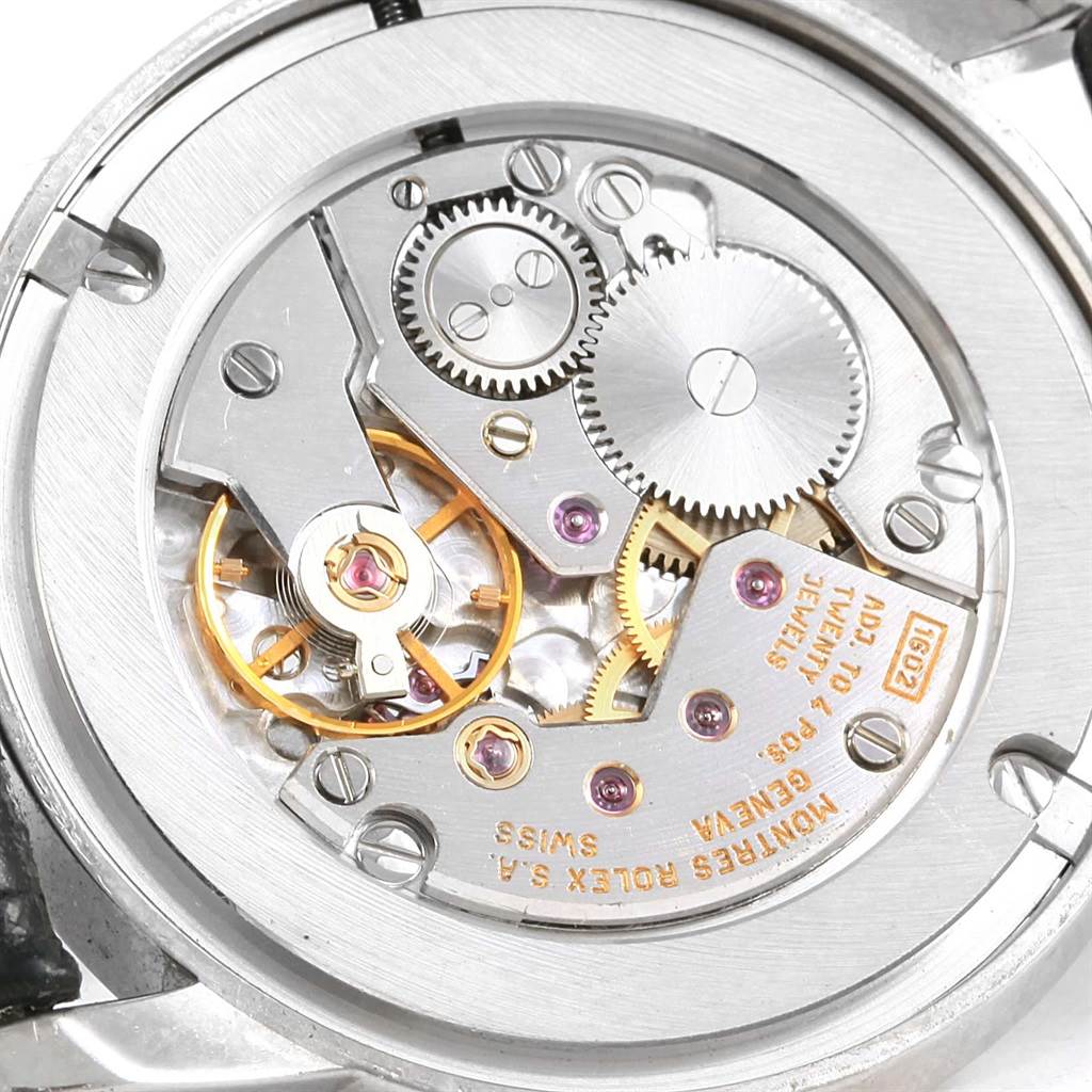 The image shows the intricate internal mechanism of a Rolex Cellini 5116 Men's White Gold Grey Dial 5116 Men's White Gold Grey Dial watch viewed from the back.