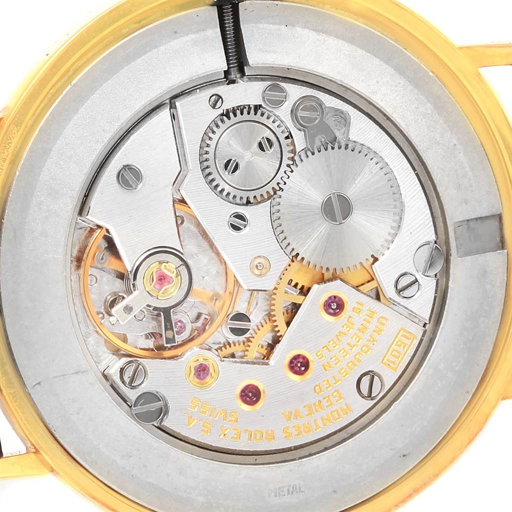 This image shows an open back view of the Rolex Cellini 4112 Yellow Gold Champagne Dial 4112 Yellow Gold Champagne Dial watch, highlighting the intricate movement and gears.