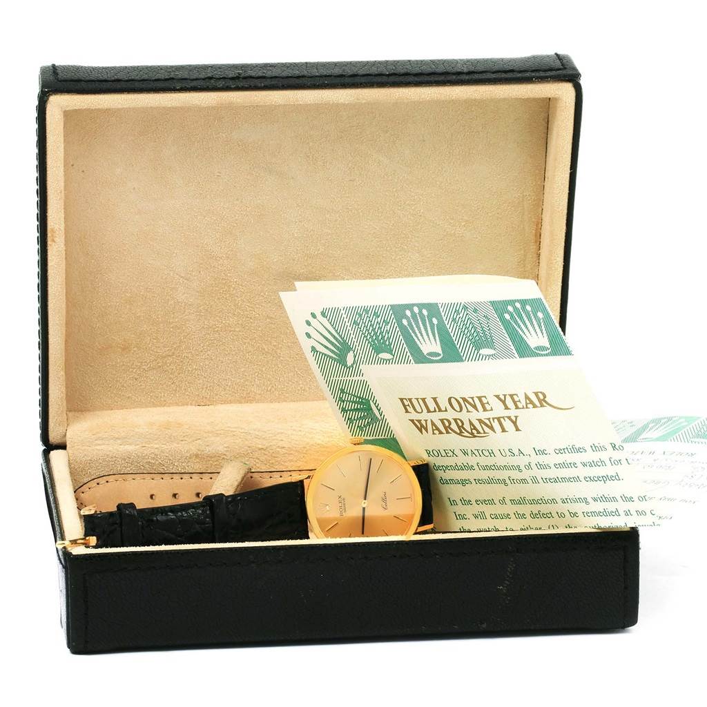 The image shows a Rolex Cellini 4112 Yellow Gold Champagne Dial 4112 Yellow Gold Champagne Dial watch, its case, and warranty card from a front angle.