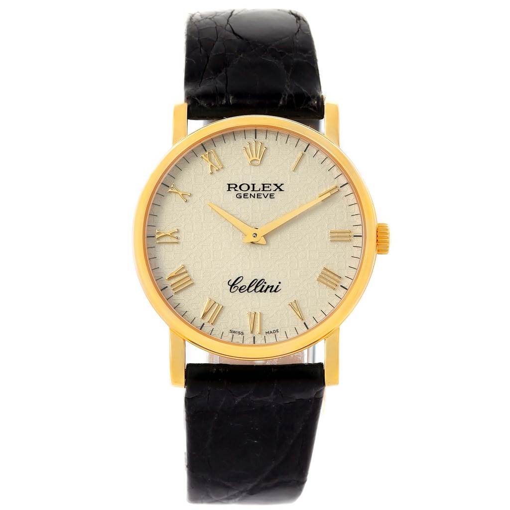 The image shows a front view of a Rolex Cellini 5115 Yellow Gold Beige Dial 5115 Yellow Gold Beige Dial watch, highlighting its face, gold casing, and black leather strap.