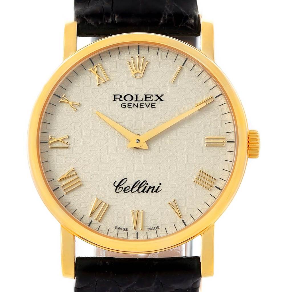 The image shows a frontal view of a Rolex Cellini 5115 Yellow Gold Beige Dial 5115 Yellow Gold Beige Dial watch, highlighting the face, markers, hands, and part of the black strap.