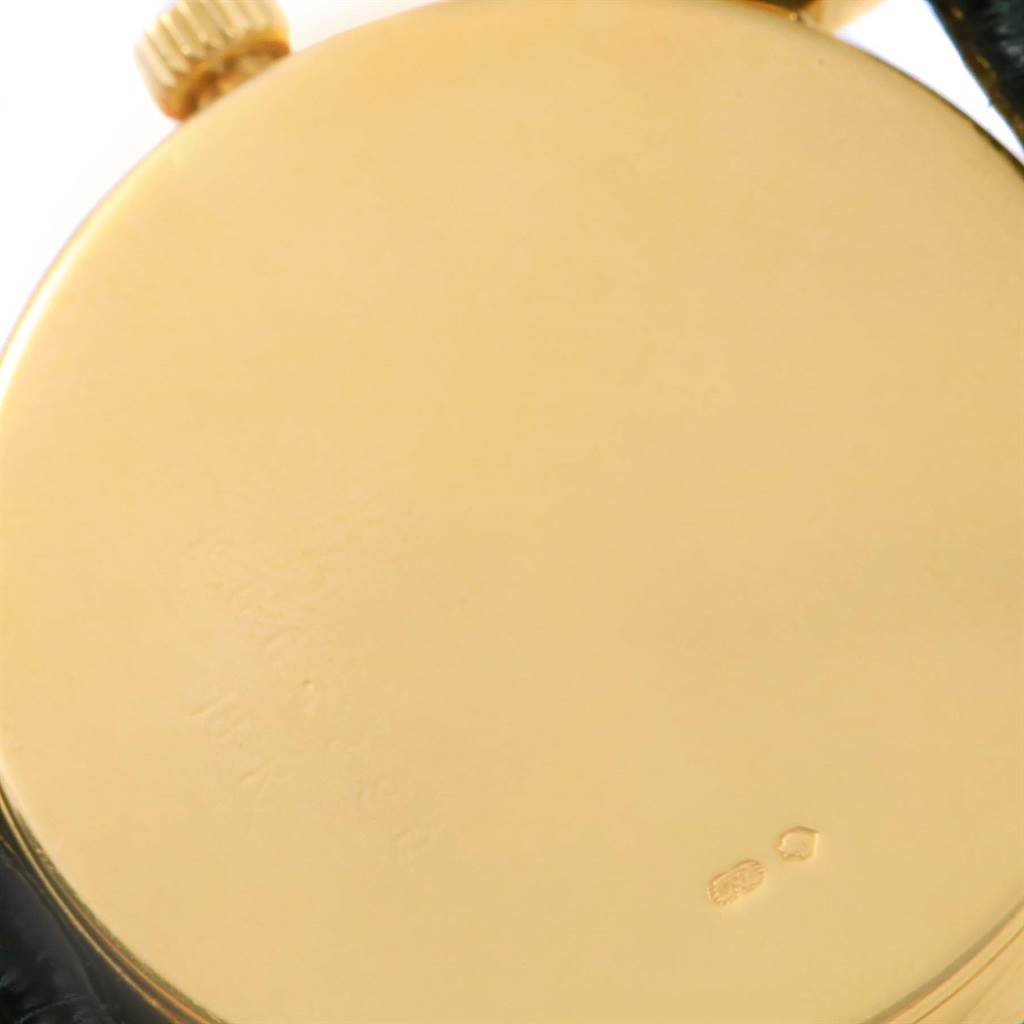 The image shows the back case and crown of a Rolex Cellini 5115 Yellow Gold Beige Dial 5115 Yellow Gold Beige Dial watch from a close-up angle.