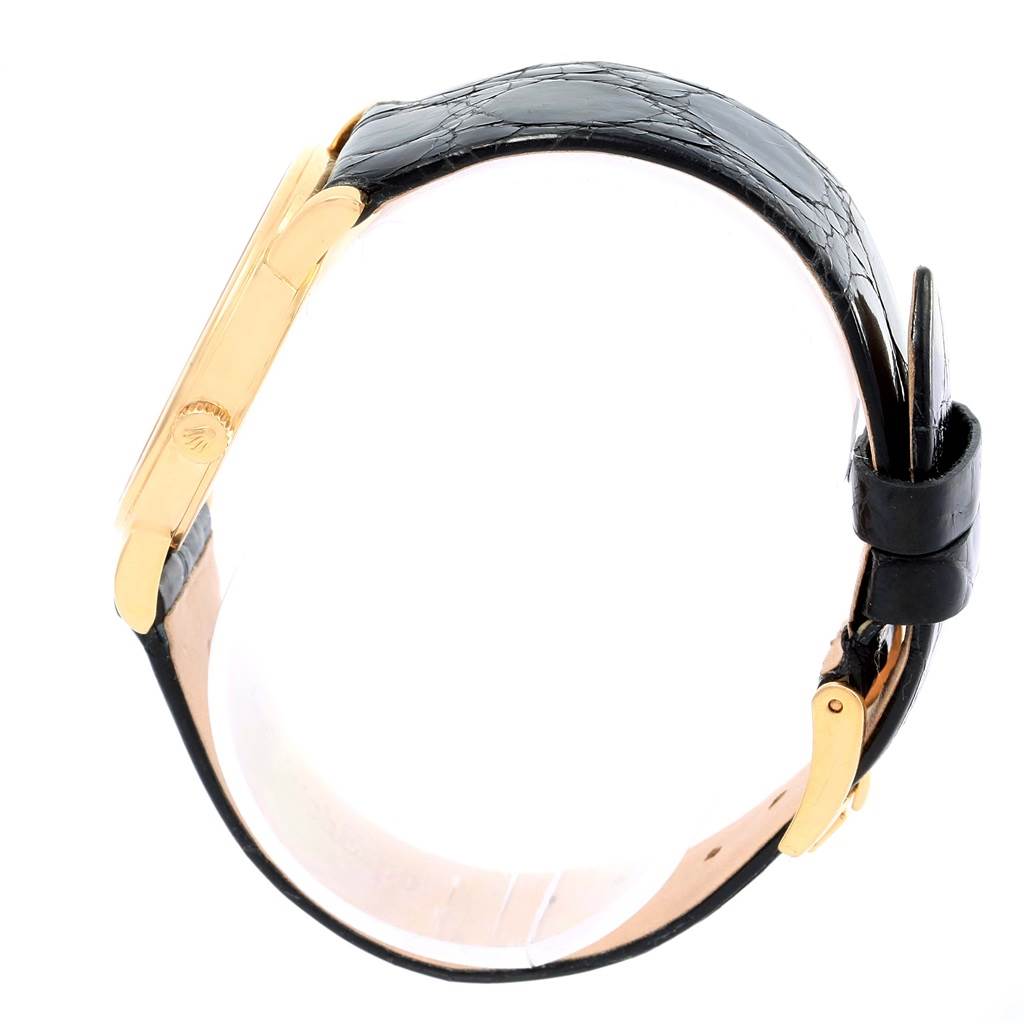 The image shows a side view of a Rolex Cellini 5115 Yellow Gold Beige Dial 5115 Yellow Gold Beige Dial watch, highlighting its leather strap and gold case.