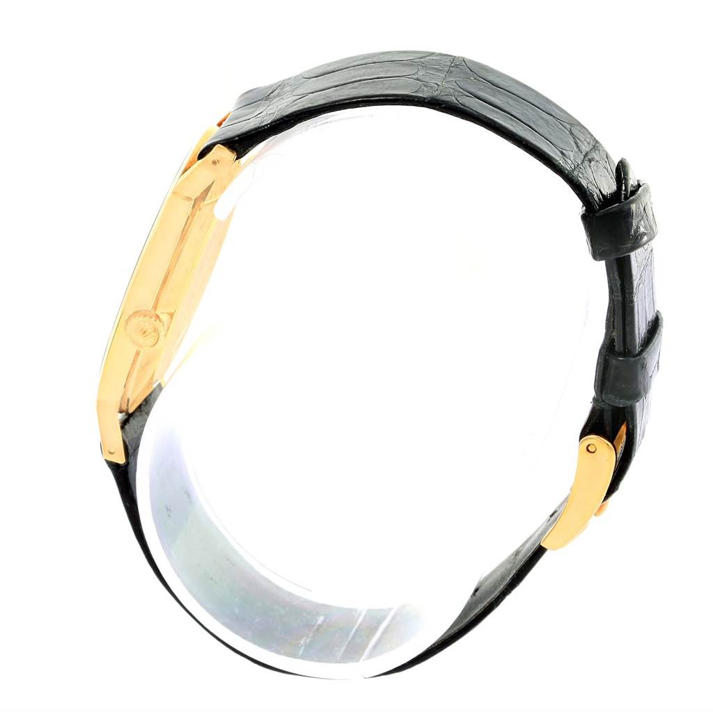 The image shows a side view of the Rolex Cellini 4112 Men's Yellow Gold Beige Dial 4112 Men's Yellow Gold Beige Dial watch highlighting its gold case and black leather strap.