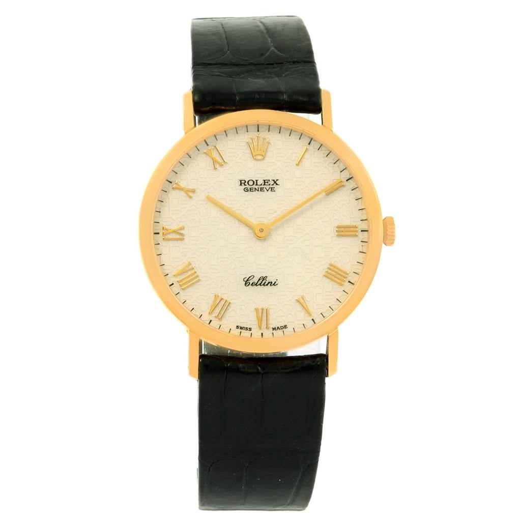 The Rolex Cellini 4112 Men's Yellow Gold Beige Dial 4112 Men's Yellow Gold Beige Dial watch is shown from a front angle, displaying the full face, Roman numeral markers, and black leather strap.