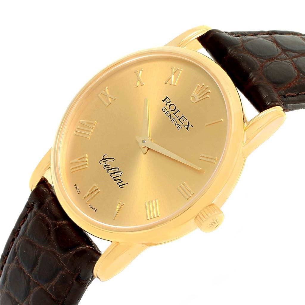 The image shows a Rolex Cellini 5116 Men's Yellow Gold Champagne Dial 5116 Men's Yellow Gold Champagne Dial watch at a slight angle, highlighting its gold case, Roman numeral dial, and brown leather strap.