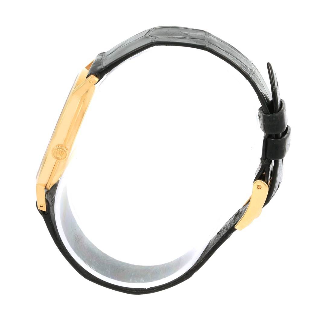 This image shows a side profile of the Rolex Cellini 4112 Men's Yellow Gold Grey Dial 4112 Men's Yellow Gold Grey Dial watch highlighting its gold case and black leather strap.