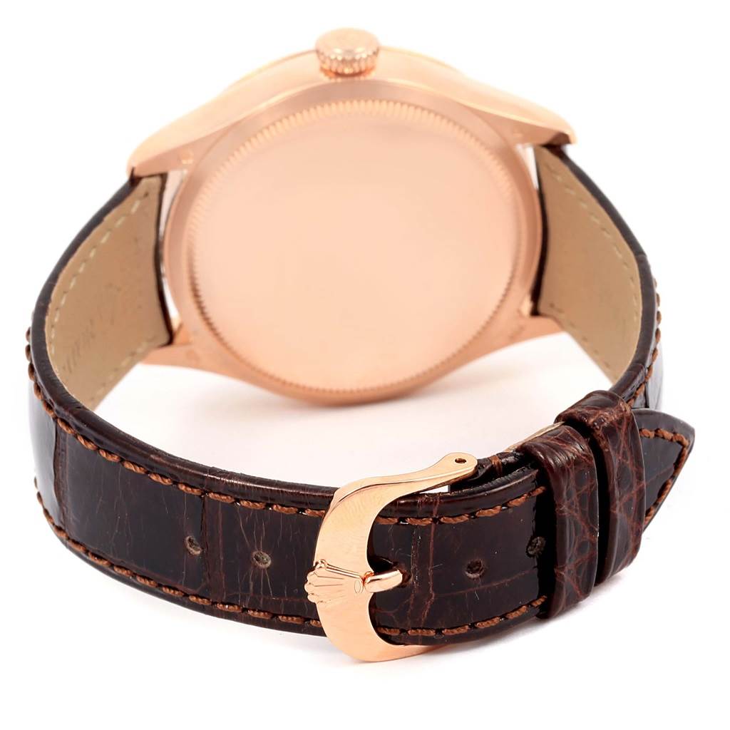 This Rolex Cellini 50525 Men's Rose Gold Silver Dial 50525 Men's Rose Gold Silver Dial watch is shown from the back, highlighting the case, crown, and brown leather strap with a gold buckle.