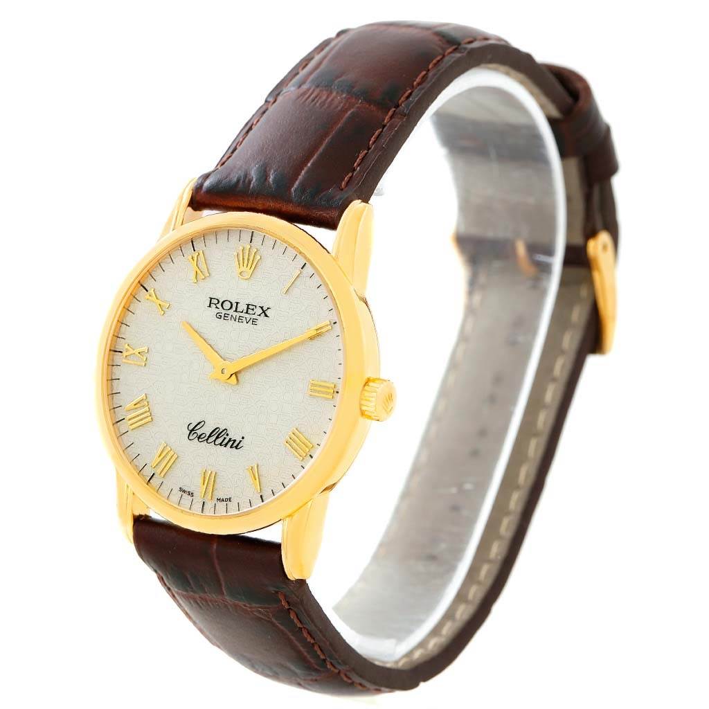 The image shows a Rolex Cellini 5116 Men's Yellow Gold Beige Dial 5116 Men's Yellow Gold Beige Dial watch at a three-quarter angle, displaying its dial, gold case, crown, and brown leather strap.