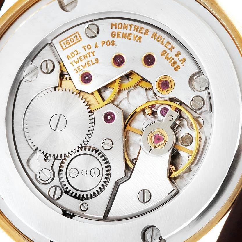 The image shows an up-close view of the movement mechanism of a Rolex Cellini 5116 Men's Yellow Gold Beige Dial 5116 Men's Yellow Gold Beige Dial watch.