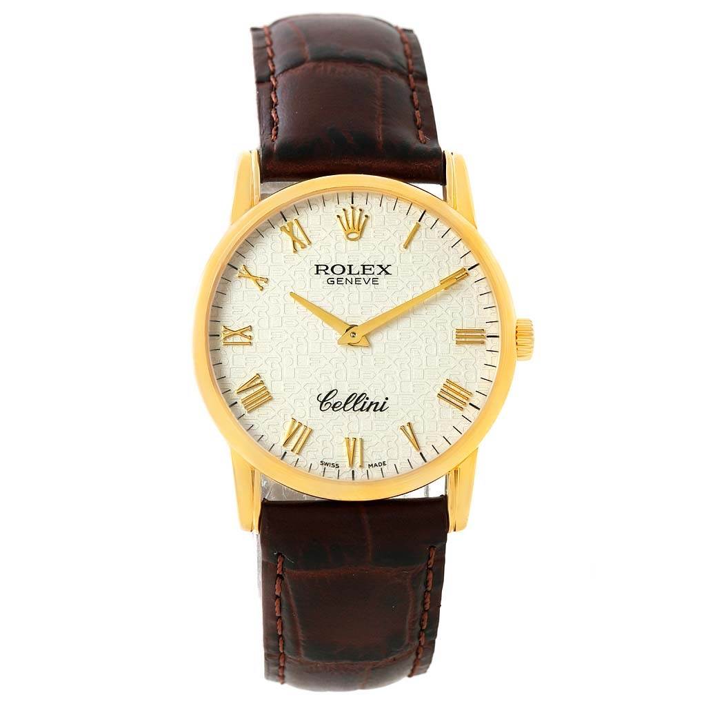 The Rolex Cellini 5116 Men's Yellow Gold Beige Dial 5116 Men's Yellow Gold Beige Dial watch is shown from a front angle, displaying its face, gold case, and brown leather strap.