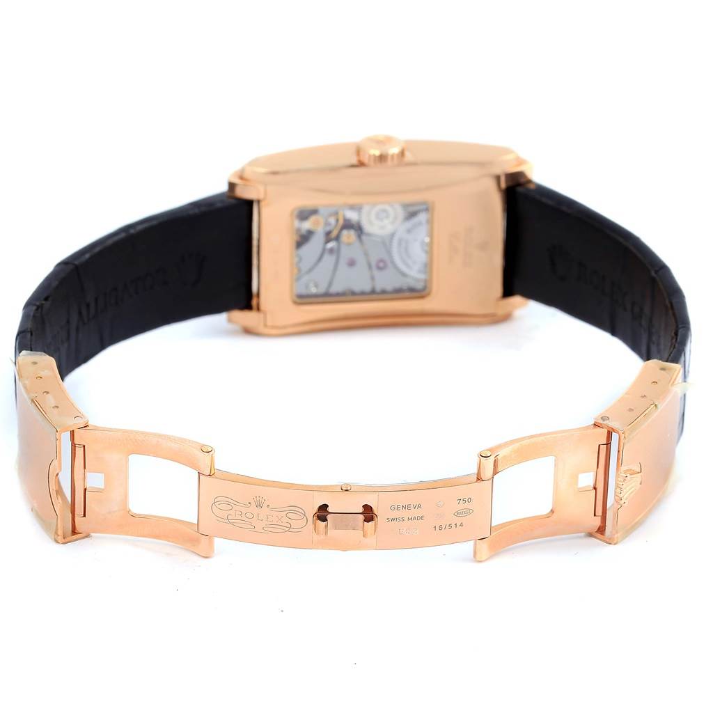 The image shows the partially open clasp and back of the Rolex Cellini 5442 Men's Rose Gold Black Dial 5442 Men's Rose Gold Black Dial watch, displaying the watch's interior mechanism and the leather strap.