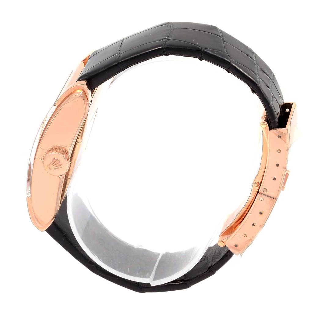 The image shows a side view of the Rolex Cellini 5442 Men's Rose Gold Black Dial 5442 Men's Rose Gold Black Dial model, focusing on the black leather strap and rose gold case.