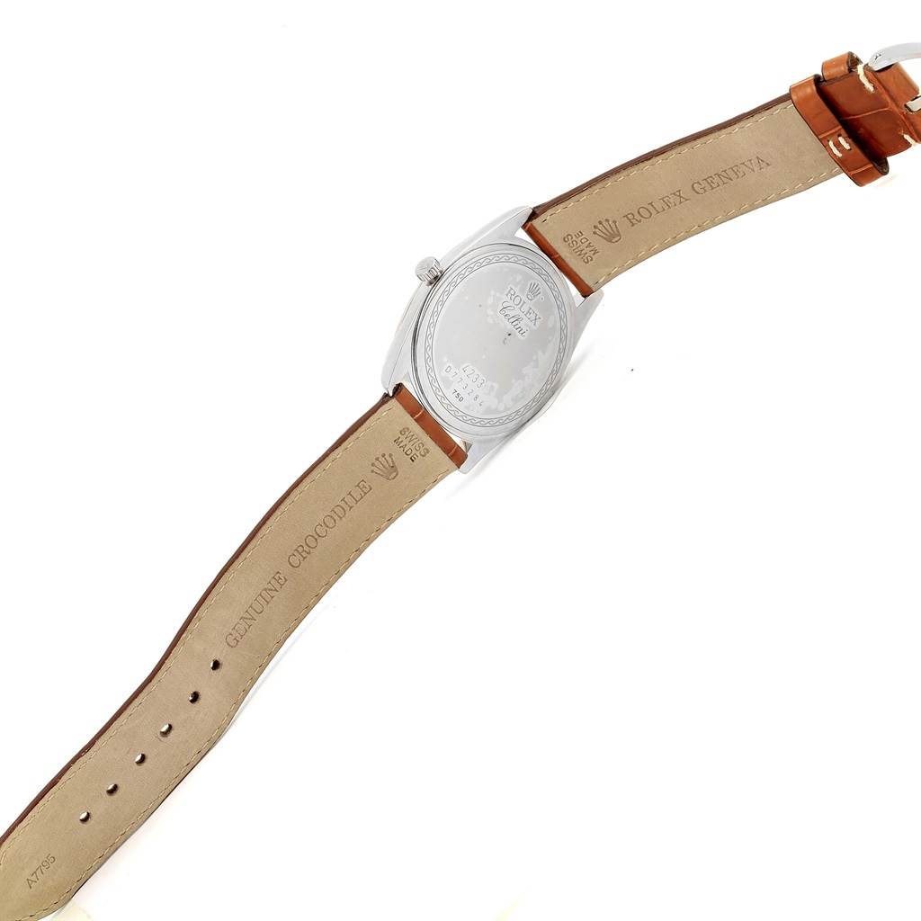 The image shows the back of a Rolex Cellini 4233 Men's White Gold Black Dial 4233 Men's White Gold Black Dial watch and its leather strap, displaying inscriptions and branding.