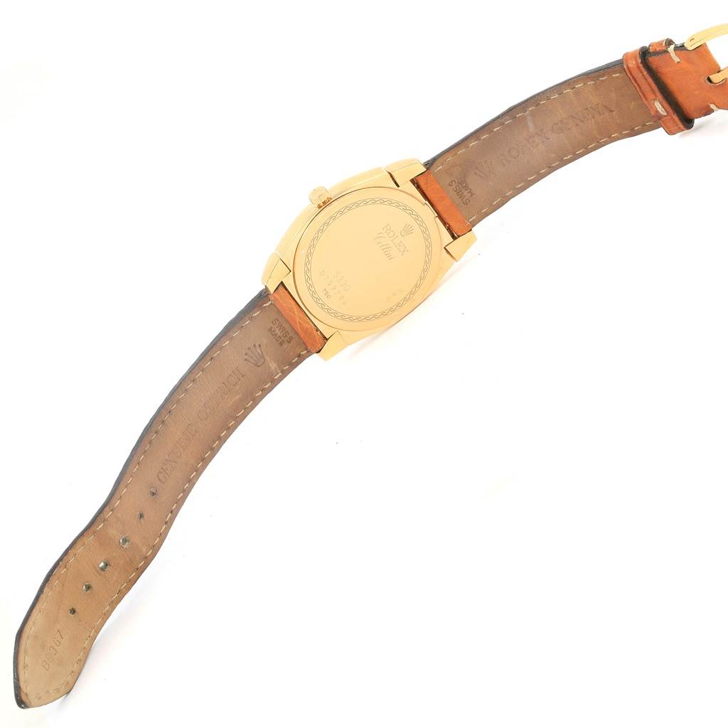 The image shows the back and leather straps of the Rolex Cellini 5330 Men's Yellow Gold White Dial 5330 Men's Yellow Gold White Dial model watch laid flat.