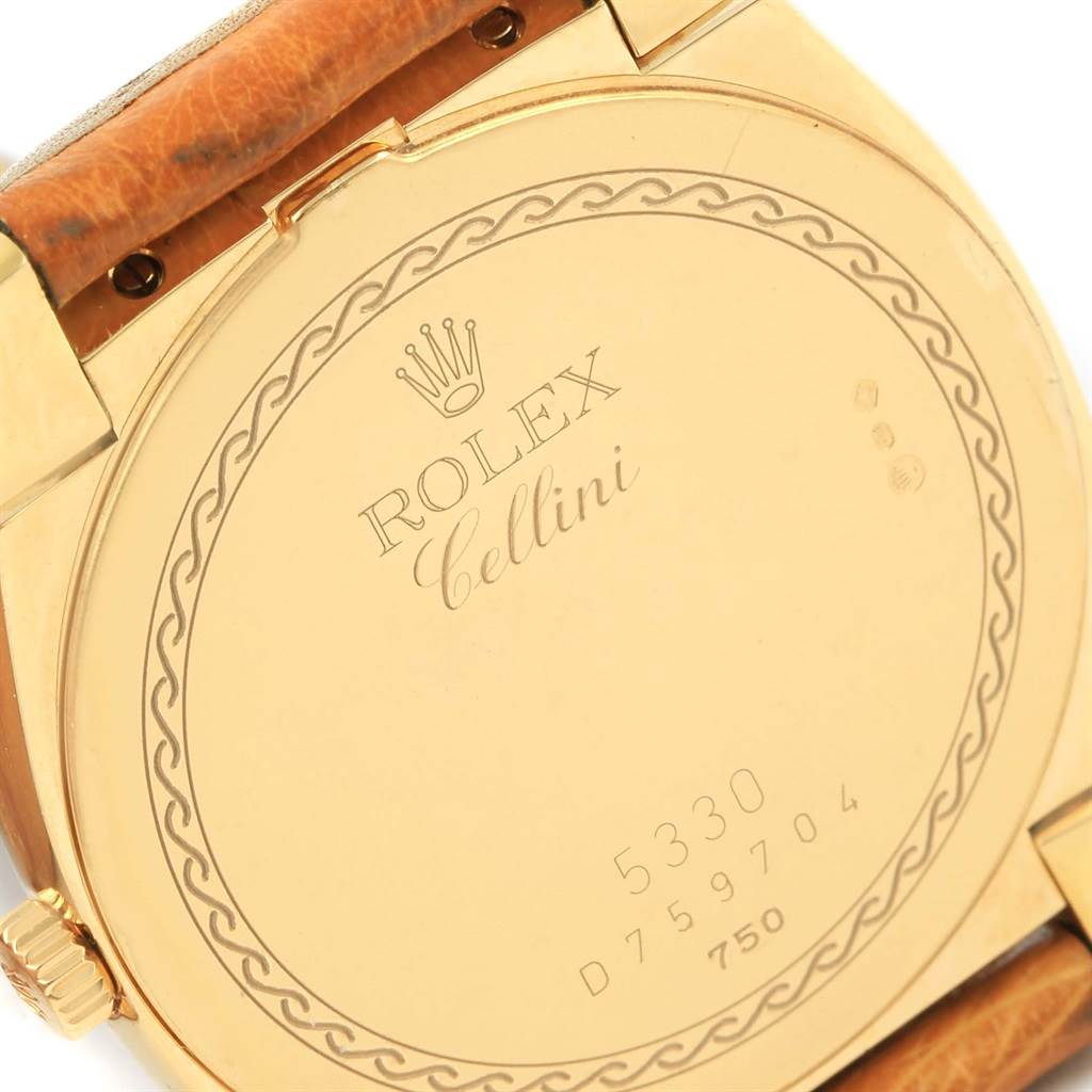 This image shows the back case of a Rolex Cellini 5330 Men's Yellow Gold White Dial 5330 Men's Yellow Gold White Dial watch, viewed at an angle highlighting engraved details.