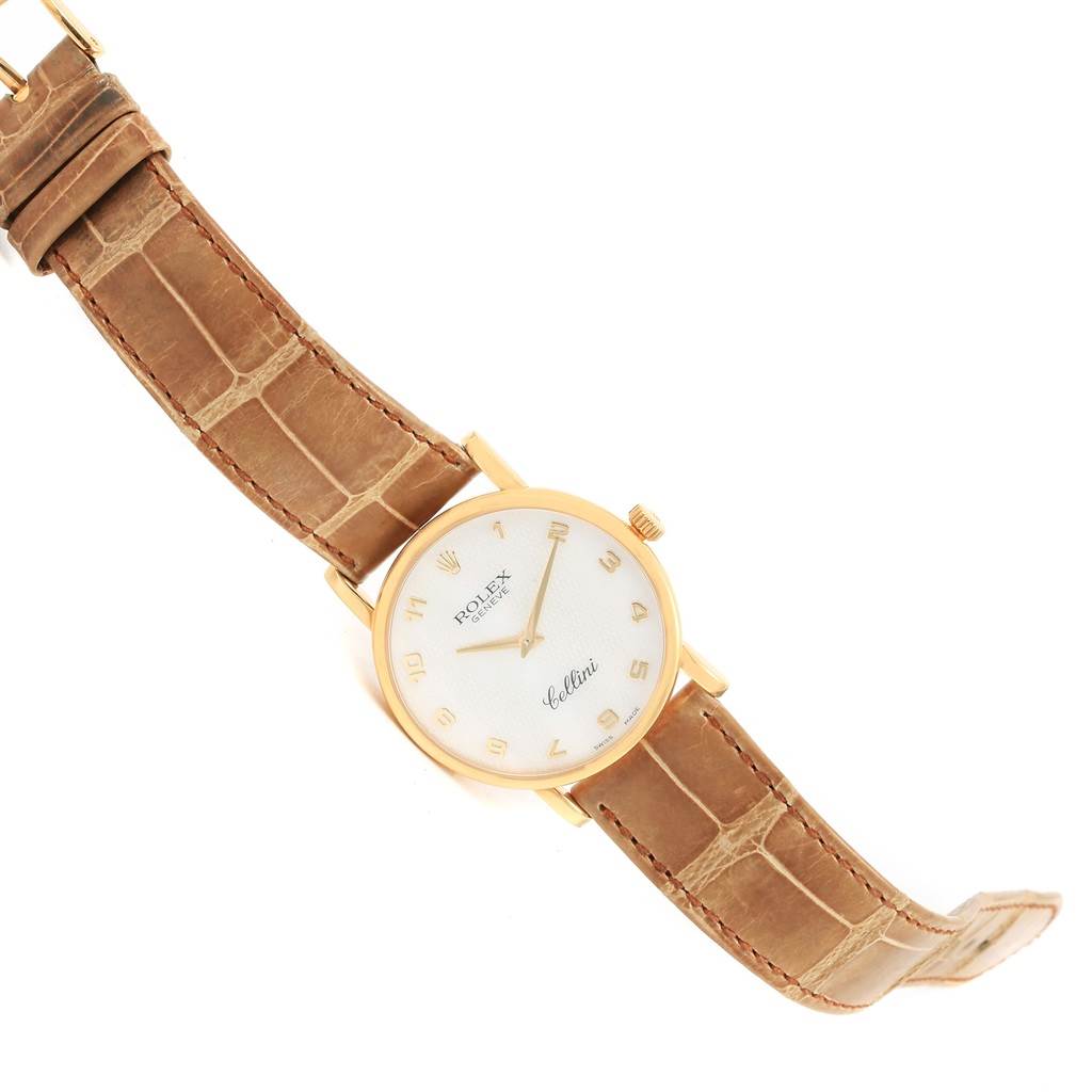 The image shows a Rolex Cellini 5115 Yellow Gold Mother of Pearl Dial 5115 Yellow Gold Mother of Pearl Dial watch at a slight angle, highlighting its face, hands, crown, and leather strap.