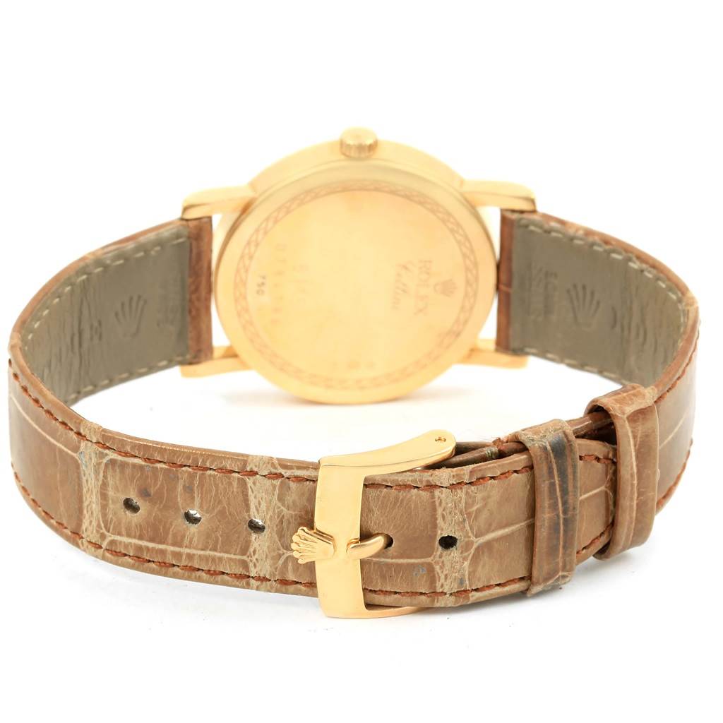 The image shows the back view of a Rolex Cellini 5115 Yellow Gold Mother of Pearl Dial 5115 Yellow Gold Mother of Pearl Dial watch, highlighting its case back, leather strap, and buckle.