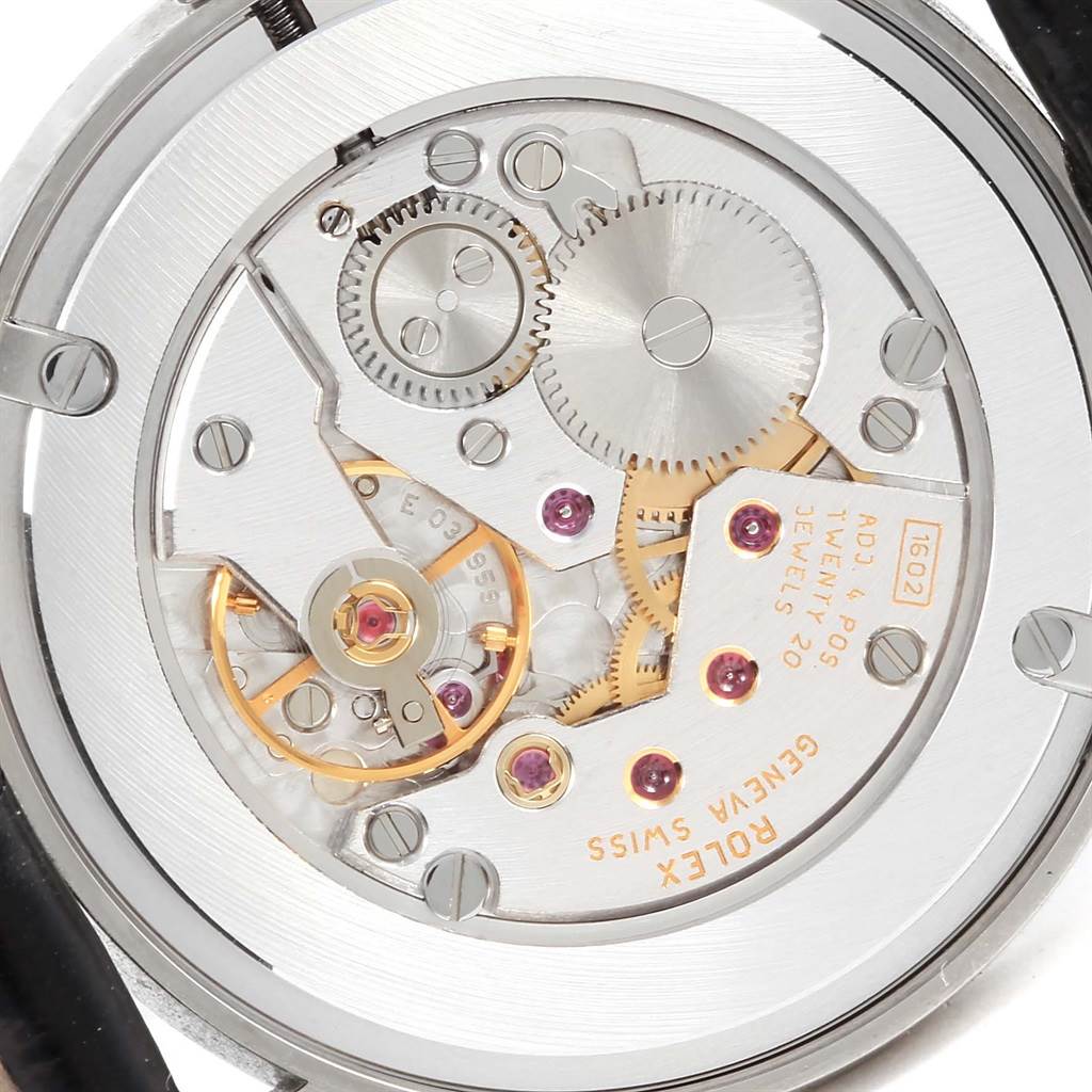 The image shows the Rolex Cellini 5115 White Gold Silver Dial 5115 White Gold Silver Dial watch's internal mechanics from the back, detailing gears and components.