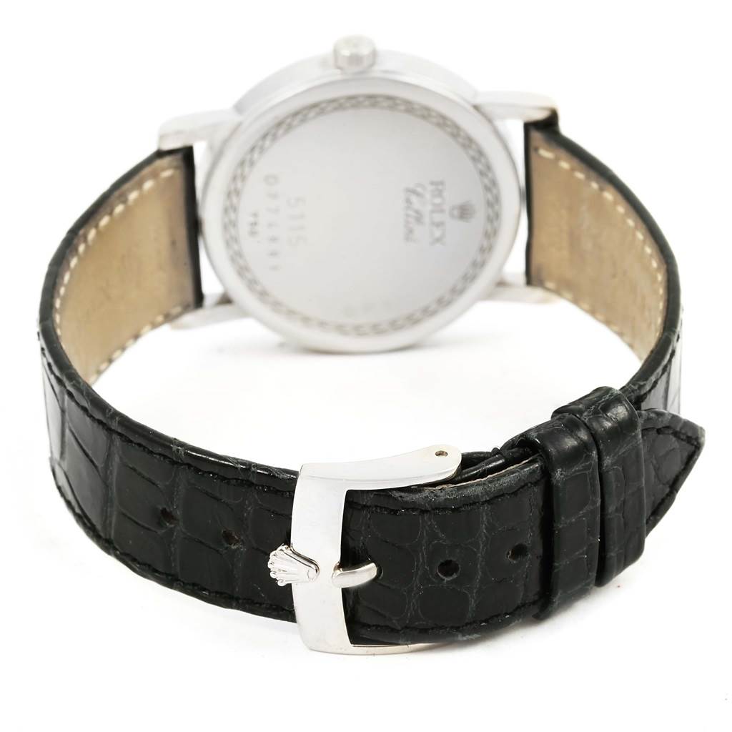 The image shows the back view of a Rolex Cellini 5115 White Gold Silver Dial 5115 White Gold Silver Dial watch, highlighting its leather strap and clasp.