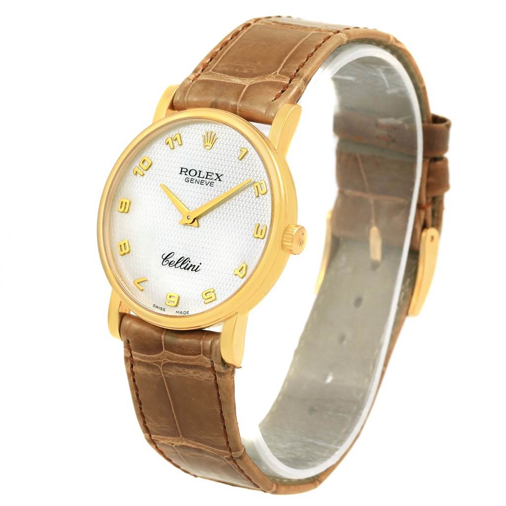 This image shows a Rolex Cellini 5115 Yellow Gold Mother of Pearl Dial 5115 Yellow Gold Mother of Pearl Dial watch at an angled view, highlighting its dial, case, and leather strap.