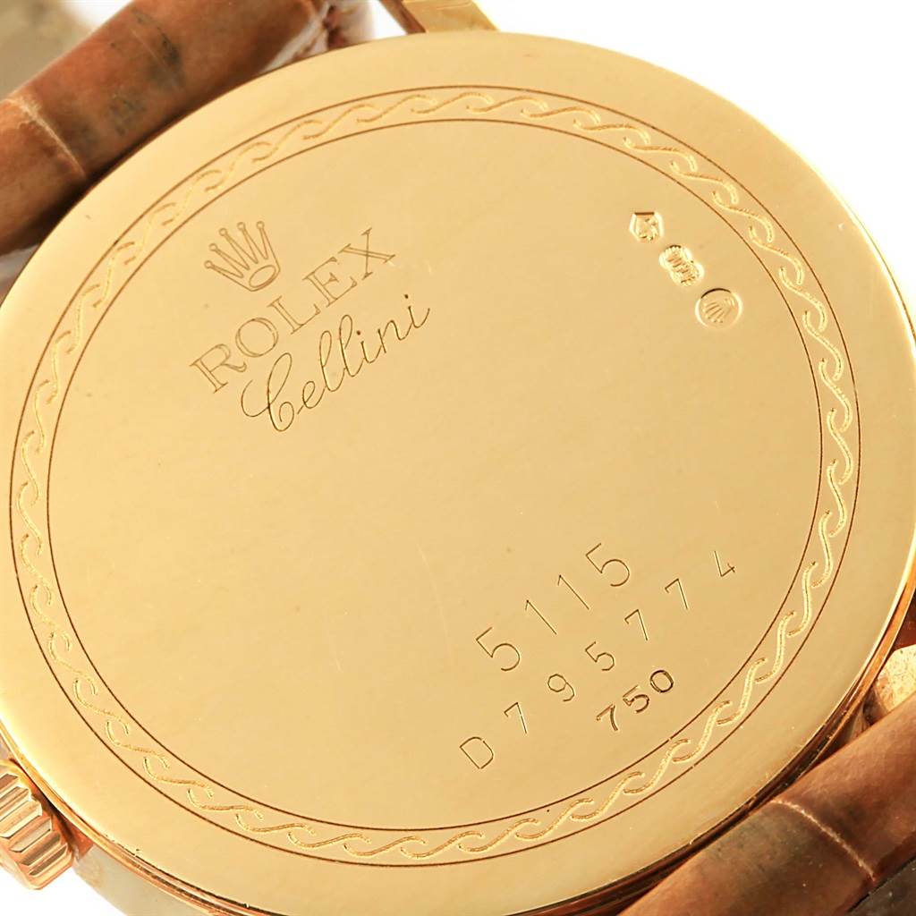 The image shows the back case of a Rolex Cellini 5115 Yellow Gold Mother of Pearl Dial 5115 Yellow Gold Mother of Pearl Dial model watch, featuring its inscriptions and serial numbers.