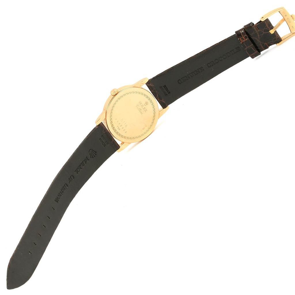 This image shows the back view of a Rolex Cellini 5116 Men's Yellow Gold Beige Dial 5116 Men's Yellow Gold Beige Dial model watch, including the case back, crown, and strap with a buckle.
