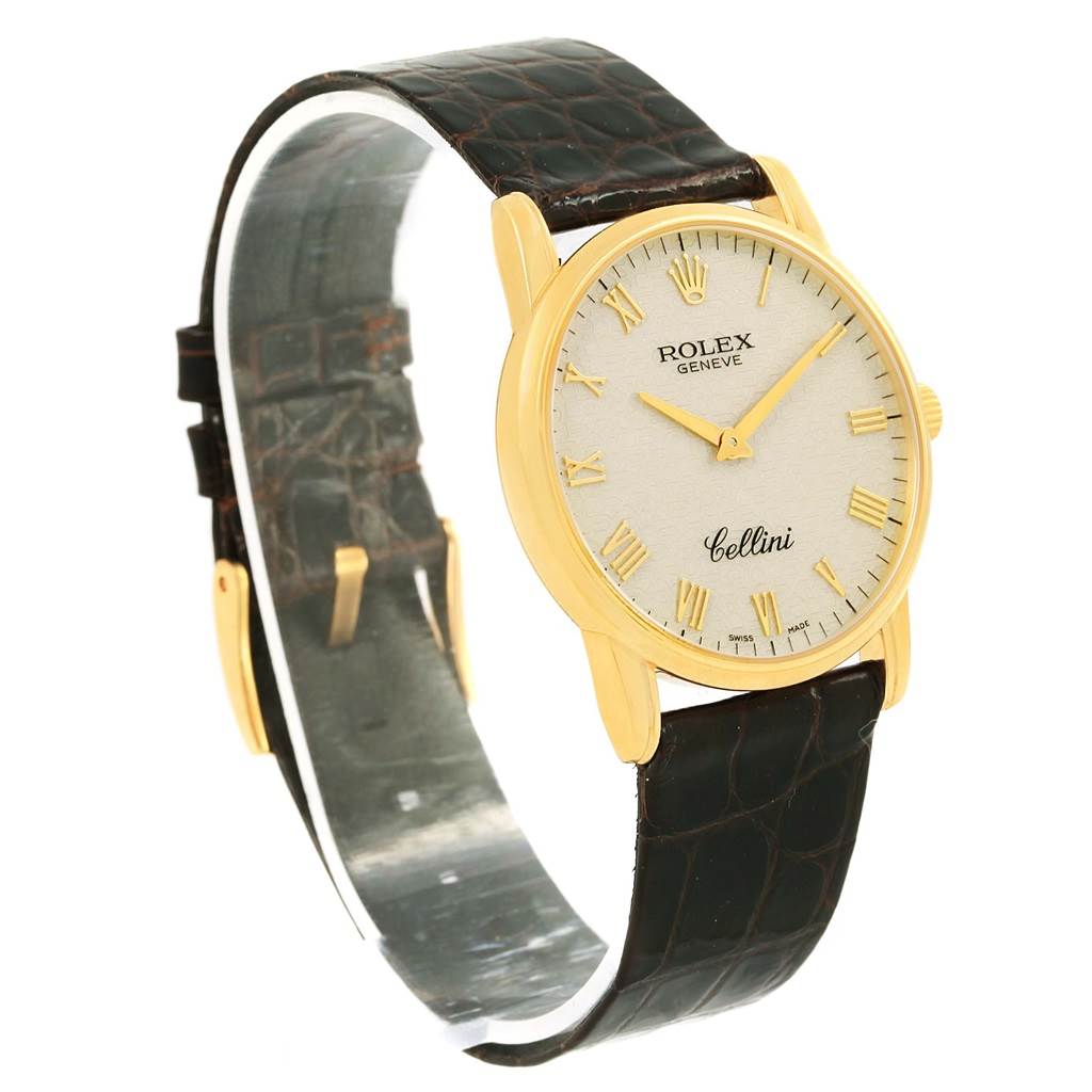 The image shows a Rolex Cellini 5116 Men's Yellow Gold Beige Dial 5116 Men's Yellow Gold Beige Dial watch at a slight angle displaying the watch face with gold Roman numerals and a dark leather strap.