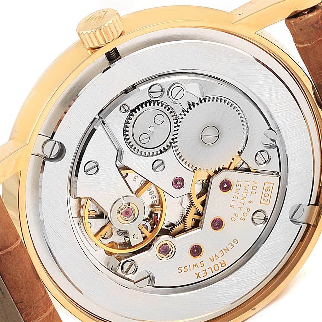 The image shows the movement mechanism and case back of a Rolex Cellini 5115 Yellow Gold Mother of Pearl Dial 5115 Yellow Gold Mother of Pearl Dial watch at a slight angle.
