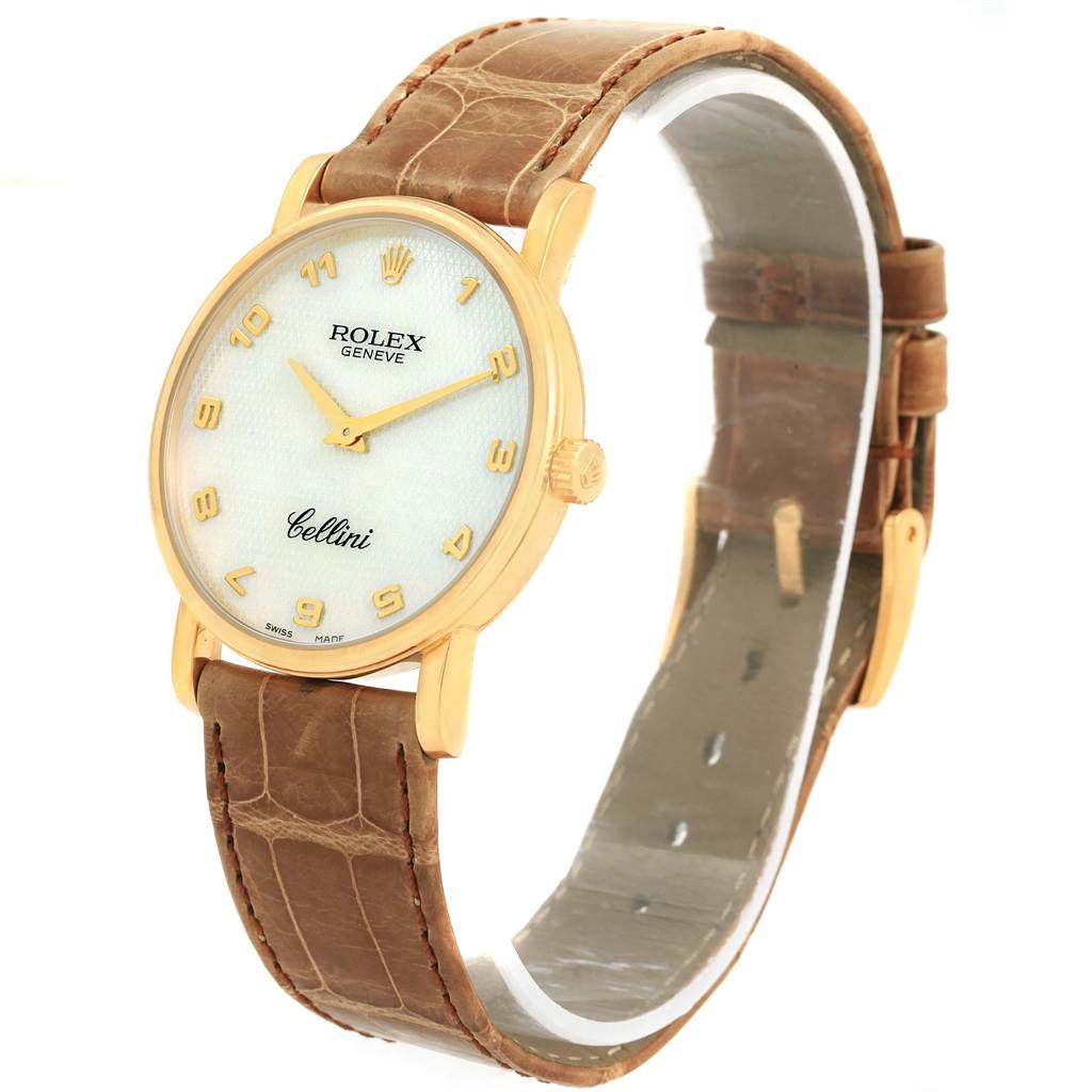 The image shows a Rolex Cellini 5115 Yellow Gold Mother of Pearl Dial 5115 Yellow Gold Mother of Pearl Dial watch from an angled front view, displaying the face, hands, case, crown, and the leather strap.