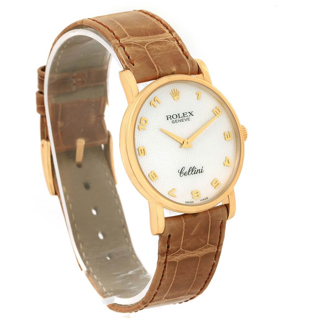 This image shows a Rolex Cellini 5115 Yellow Gold Mother of Pearl Dial 5115 Yellow Gold Mother of Pearl Dial watch at an angle showcasing its full face, gold case, and leather strap.
