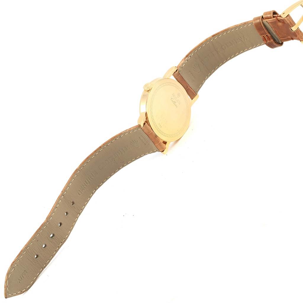 The image shows the backside and strap of a Rolex Cellini 5115 Yellow Gold Mother of Pearl Dial 5115 Yellow Gold Mother of Pearl Dial watch, viewed from an angle that highlights the watch's case back and leather strap.