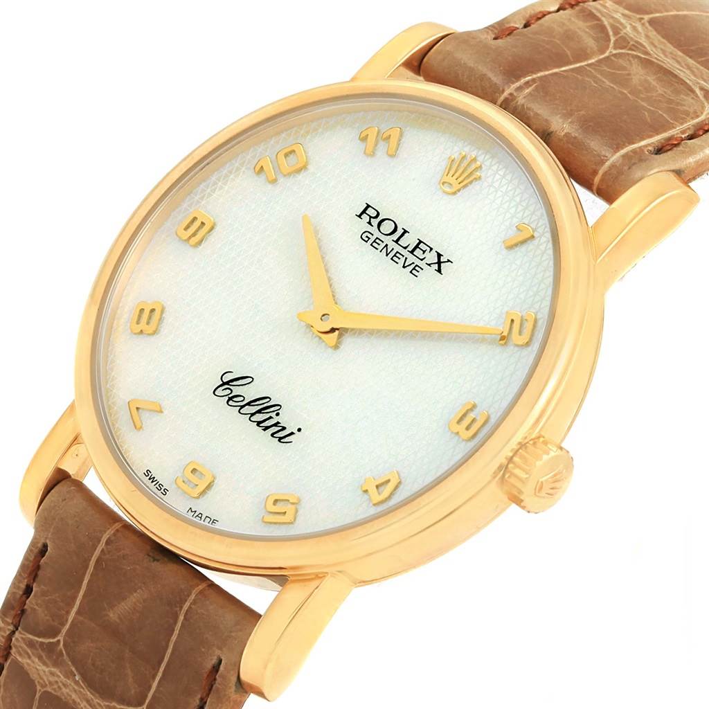This image shows a close-up of the Rolex Cellini 5115 Yellow Gold Mother of Pearl Dial 5115 Yellow Gold Mother of Pearl Dial watch, highlighting its dial, golden case, crown, and brown leather strap.