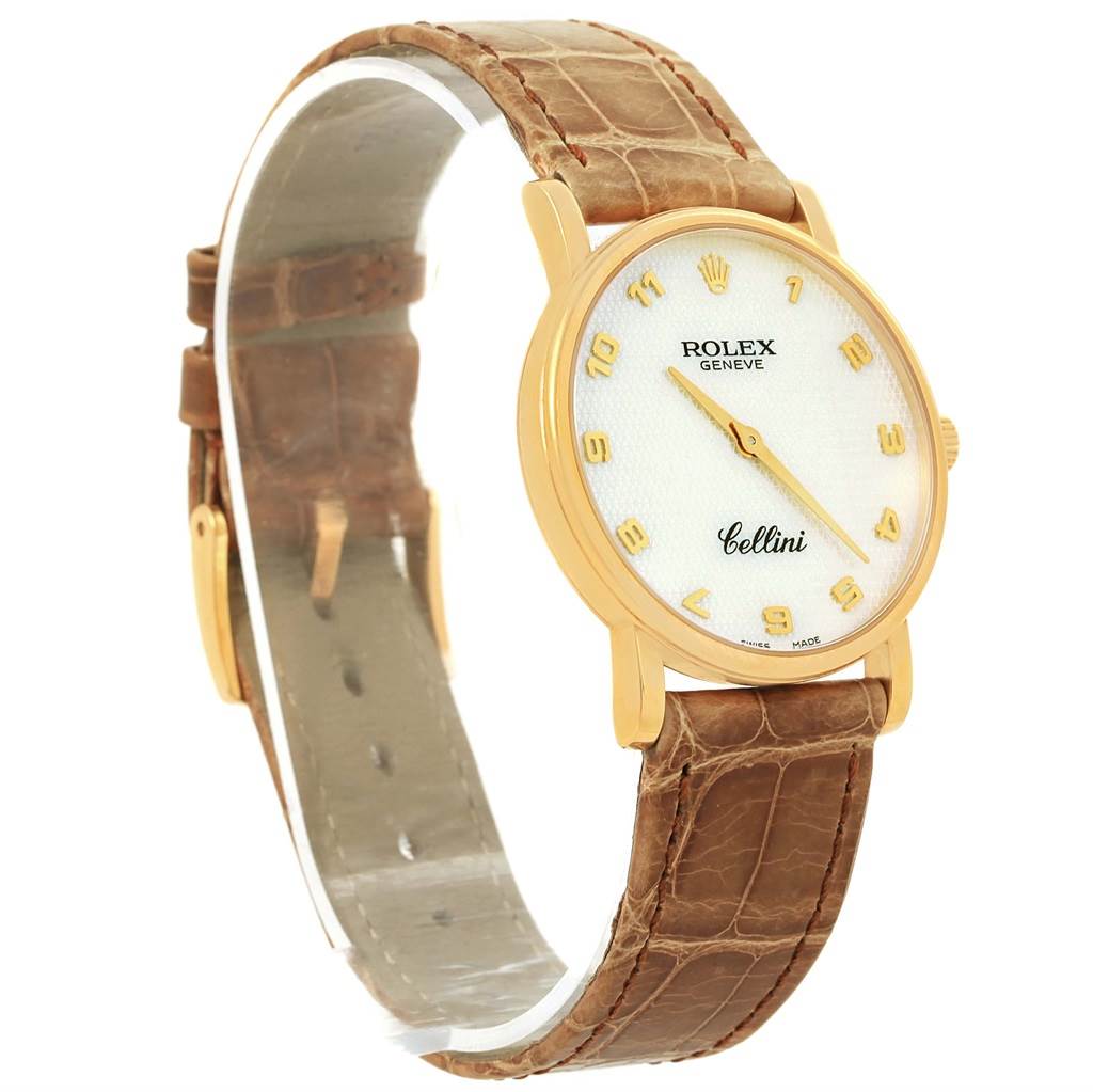 The Rolex Cellini 5115 Yellow Gold Mother of Pearl Dial 5115 Yellow Gold Mother of Pearl Dial watch is shown at a three-quarter angle, highlighting its face, gold case, and brown leather strap.