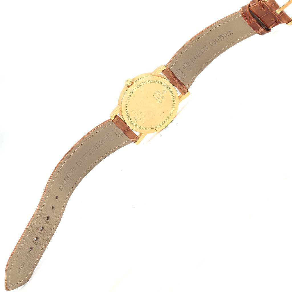 The image shows the back view of the Rolex Cellini 5115 Yellow Gold Mother of Pearl Dial 5115 Yellow Gold Mother of Pearl Dial watch, including its leather straps and gold case back.