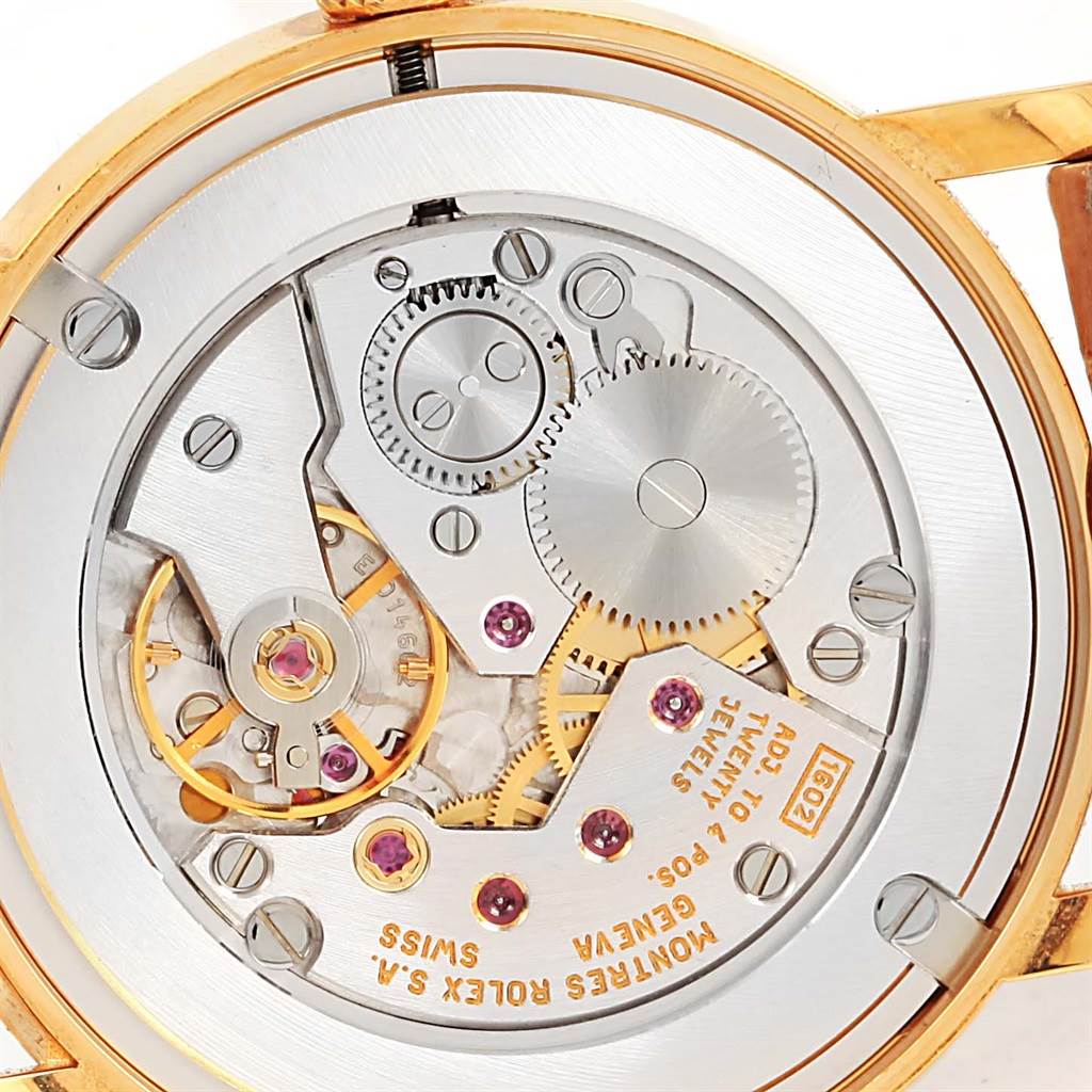 Close-up view of the mechanical movement inside a Rolex Cellini 5115 Yellow Gold Mother of Pearl Dial 5115 Yellow Gold Mother of Pearl Dial watch, showing gears and jewels.