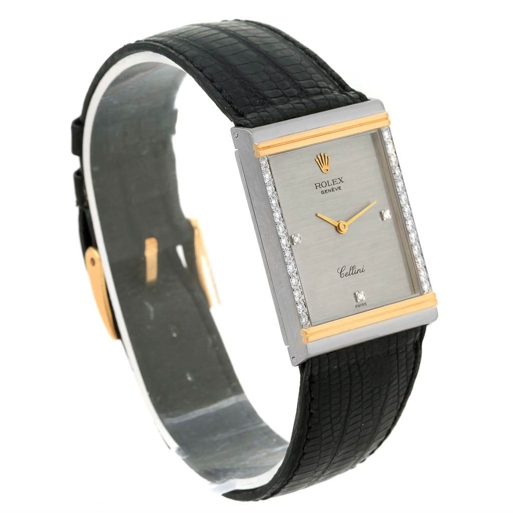 This image shows a Rolex Cellini 4127 Men's Yellow Gold Silver Dial 4127 Men's Yellow Gold Silver Dial watch from a three-quarter view, displaying its face, strap, and buckle.