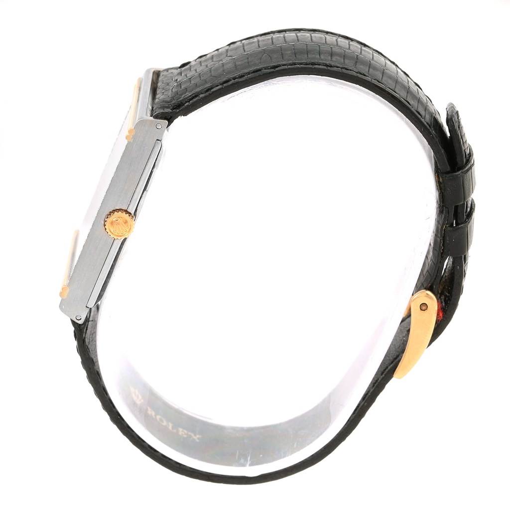 The image shows a side profile of a Rolex Cellini 4127 Men's Yellow Gold Silver Dial 4127 Men's Yellow Gold Silver Dial watch, displaying its case, crown, and leather strap with gold clasp.