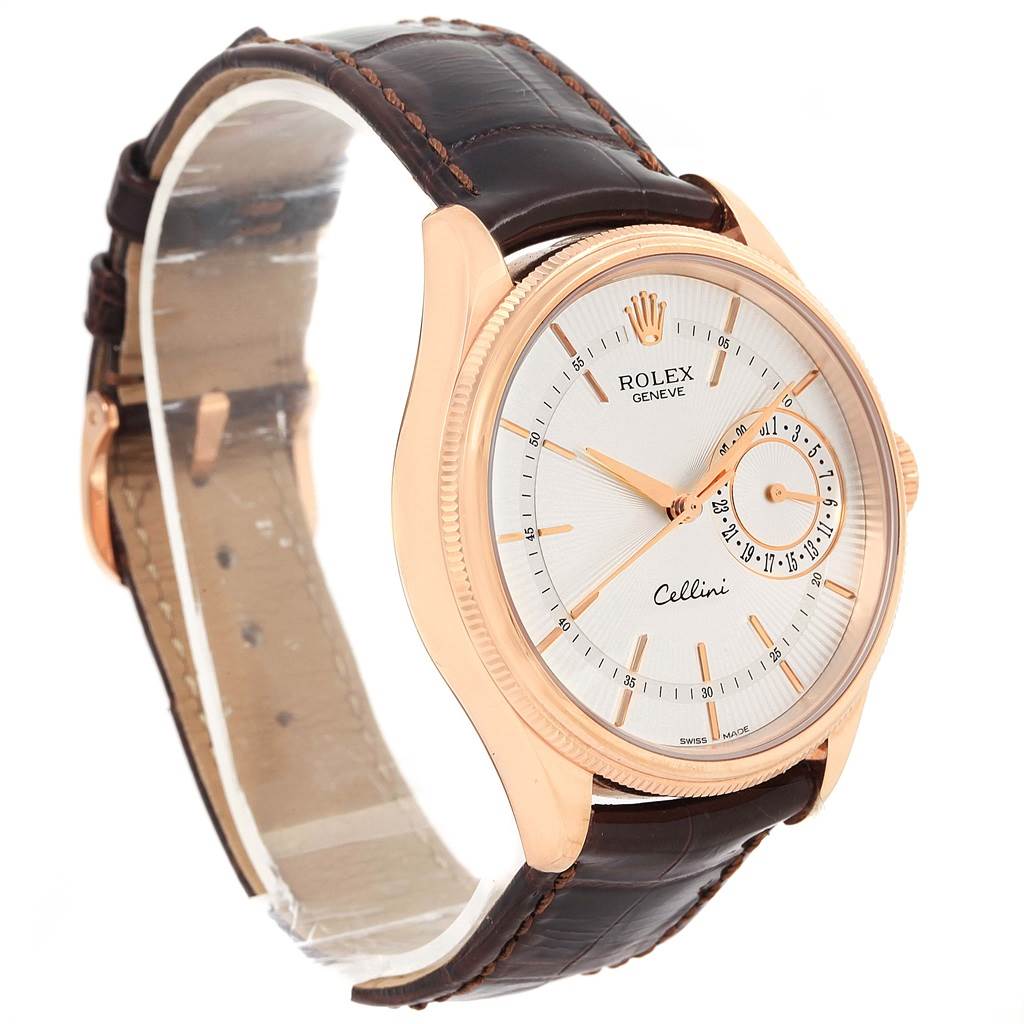The Rolex Cellini 50515 Men's Rose Gold Silver Dial 50515 Men's Rose Gold Silver Dial watch is shown at a three-quarter angle, displaying its face, case, and leather strap.