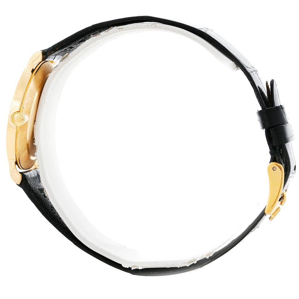 The Cellini model by Rolex is shown from a side angle, featuring a gold case, crown, black leather strap, and gold buckle.