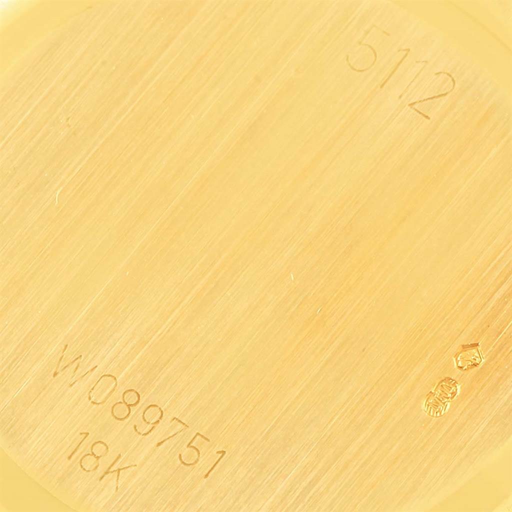 The image shows a close-up view of the back plate of a Rolex Cellini 5112 Men
s Beige Dial 5112 Men
s Beige Dial model watch, highlighting the model number and gold hallmark.