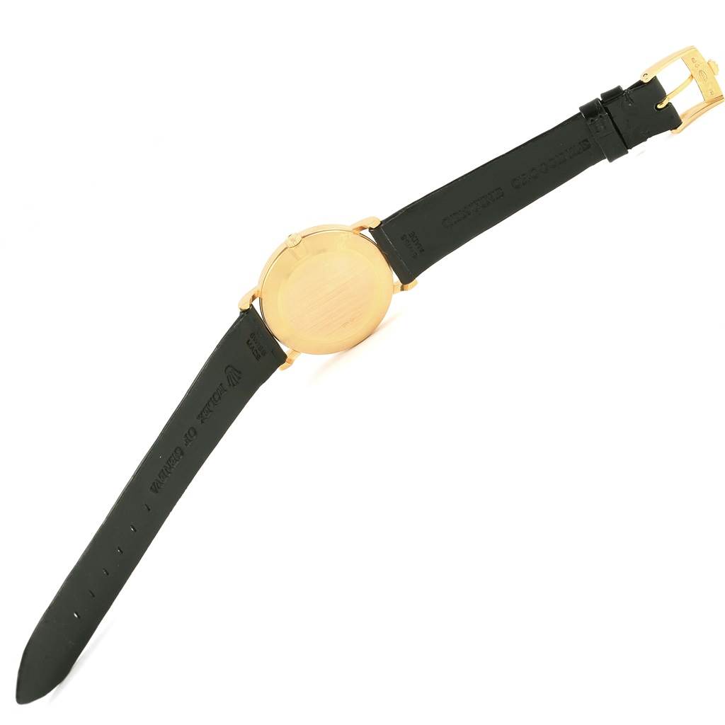 This image shows the back of a Rolex Cellini 5112 Men's Yellow Gold Beige Dial 5112 Men's Yellow Gold Beige Dial watch, displaying its gold casing and black leather strap with the buckle.