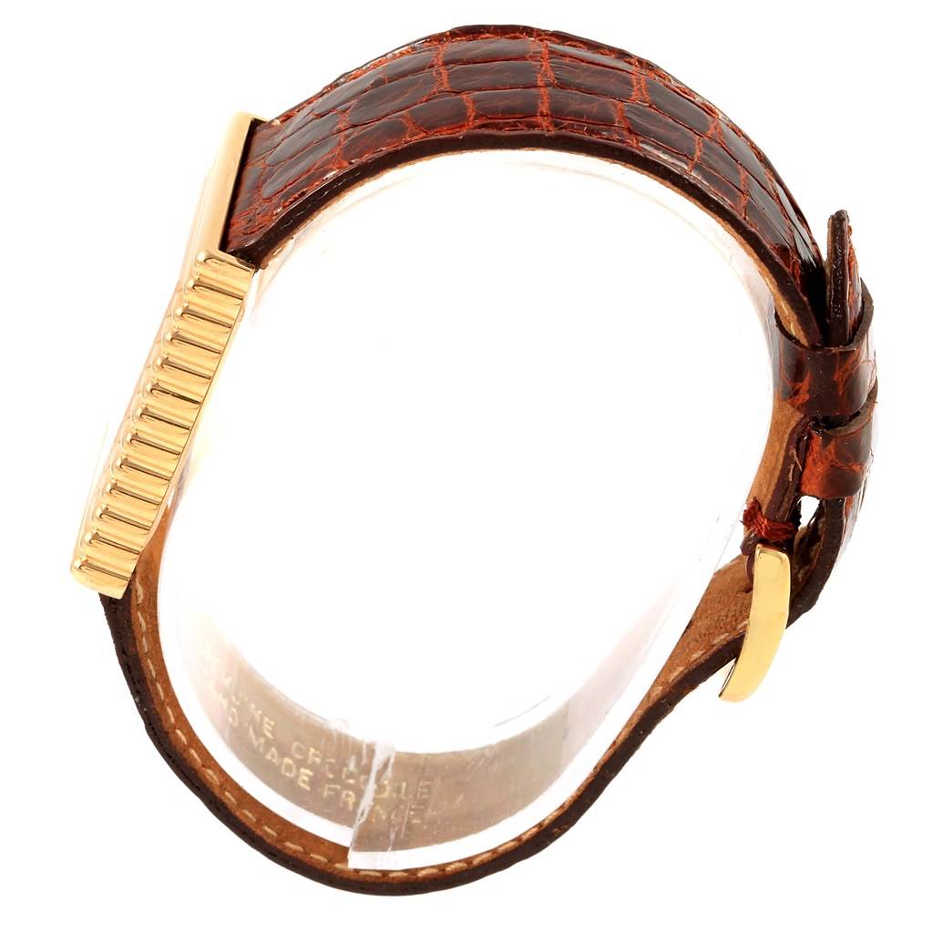 The angle shows a side view of the Rolex Cellini 4015 Men's Yellow Gold White Dial 4015 Men's Yellow Gold White Dial watch, highlighting its leather strap, gold case, and clasp.