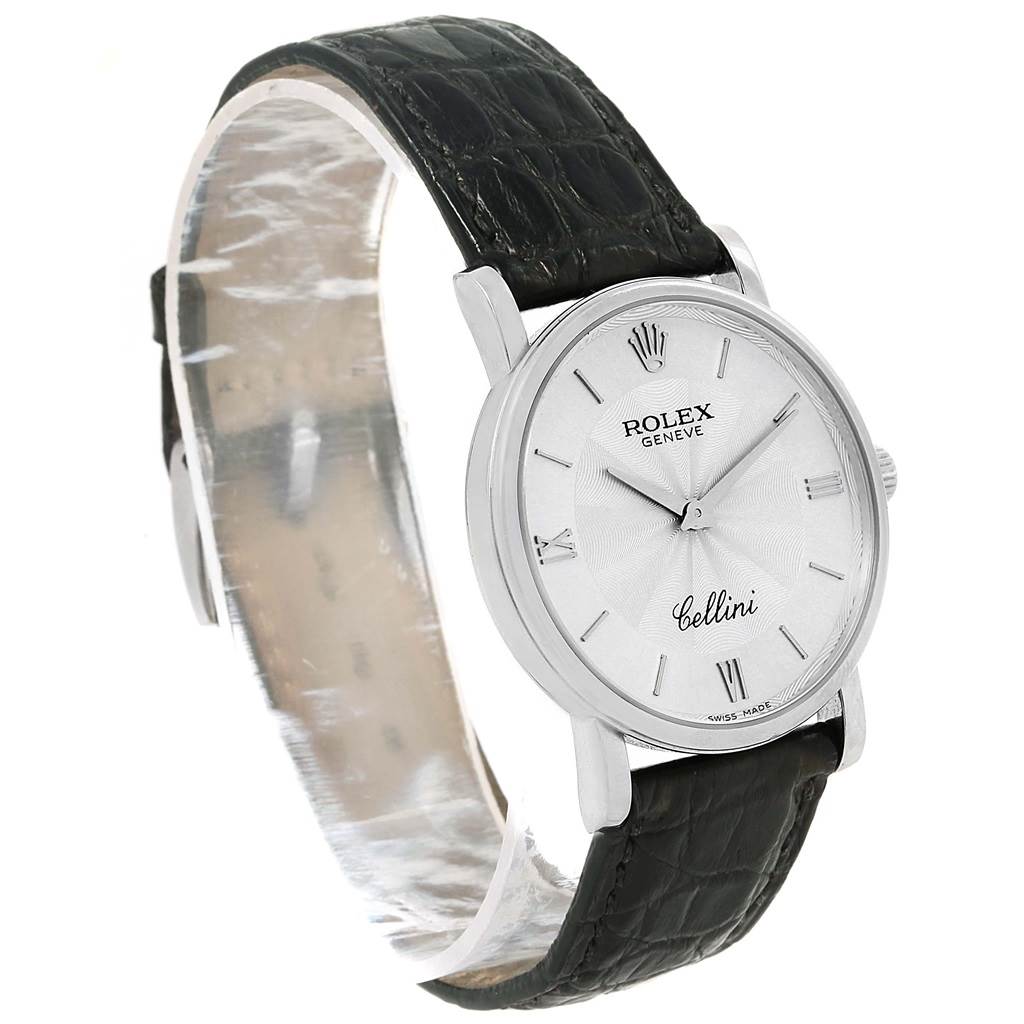 The Rolex Cellini 5115 Men
s White Gold Silver Dial 5115 Men
s White Gold Silver Dial watch is shown at an angled side view, highlighting the dial, case, and leather strap.