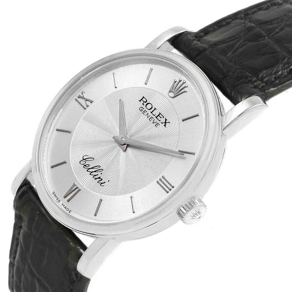 The Rolex Cellini 5115 Men
s White Gold Silver Dial 5115 Men
s White Gold Silver Dial watch is shown from a tilted front angle, displaying the dial, Roman numerals, crown, and strap.