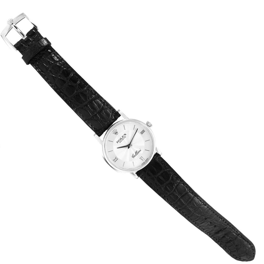 The Rolex Cellini 5115 Men
s White Gold Silver Dial 5115 Men
s White Gold Silver Dial watch is shown at a slight angle displaying its black leather strap, silver dial, and buckle.
