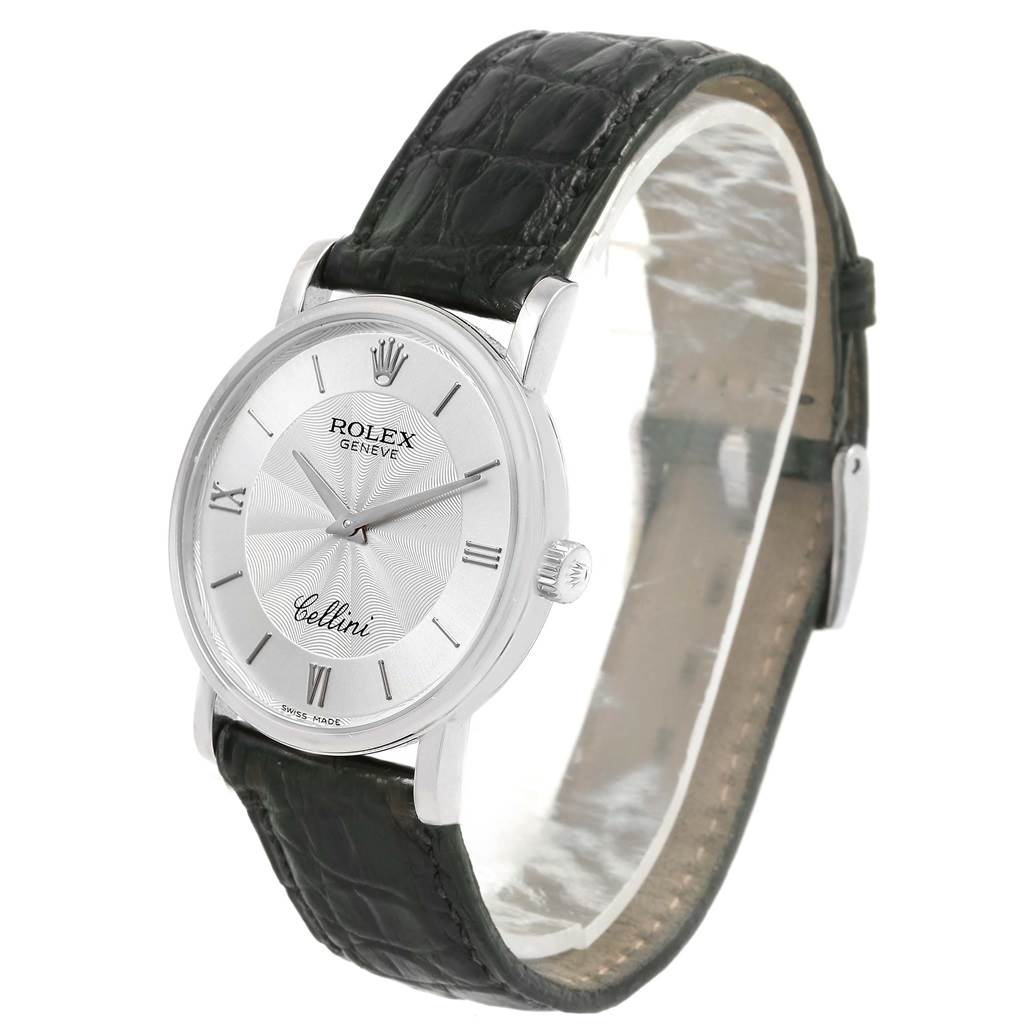 The image shows a Rolex Cellini 5115 Men
s White Gold Silver Dial 5115 Men
s White Gold Silver Dial watch at an angled side view, highlighting the face, crown, and leather strap.