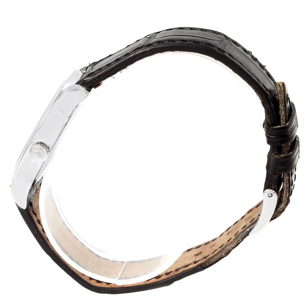 This image shows a side view of a Rolex Cellini 5240 Men's Platinum Mother of Pearl Dial 5240 Men's Platinum Mother of Pearl Dial watch, highlighting the crown, case, and dark leather strap.