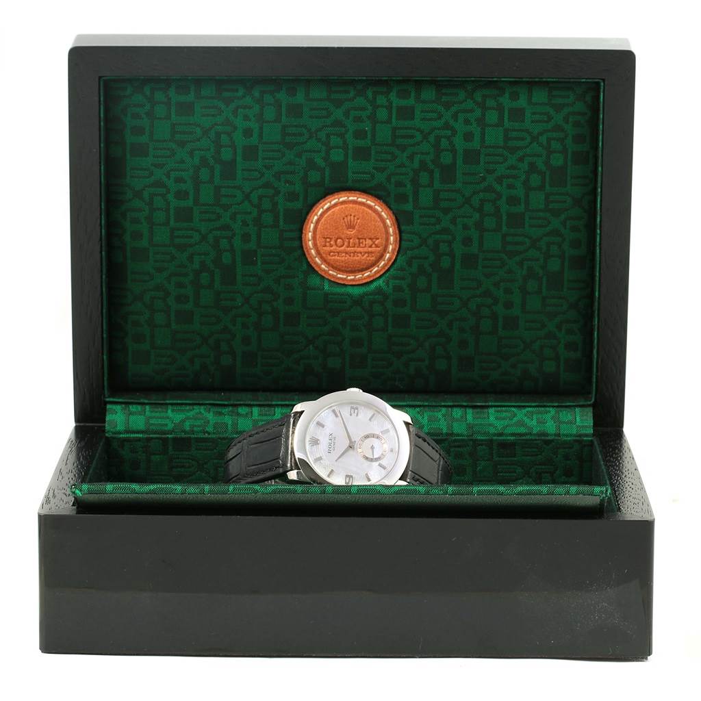 The Rolex Cellini 5240 Men's Platinum Mother of Pearl Dial 5240 Men's Platinum Mother of Pearl Dial watch is shown from a front angle, displayed inside its open box with a visible dial and leather strap.